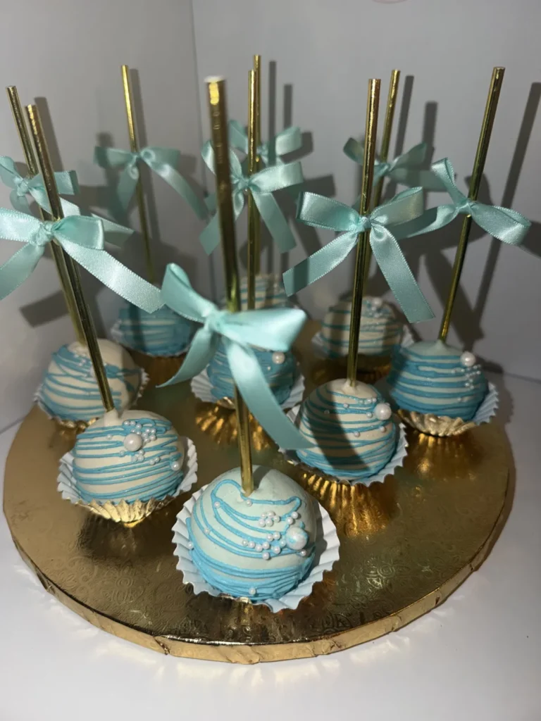 Blue cake pops tied with ribbons